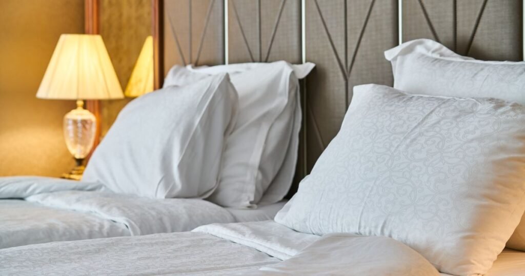 Freshly made bed with white linens, Airbnb and short-term rental turnover laundry service in Denver