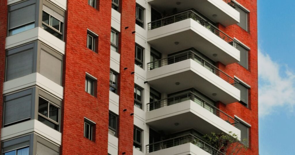 Modern red brick apartment building, laundry service for Denver apartment and condo residents